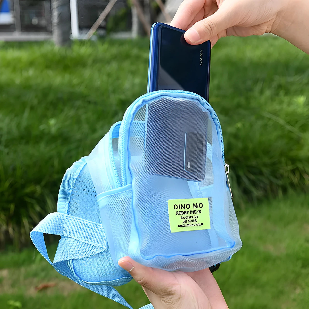 A solid-colour breathable backpack for carrying a small dog, shown in dark grey.