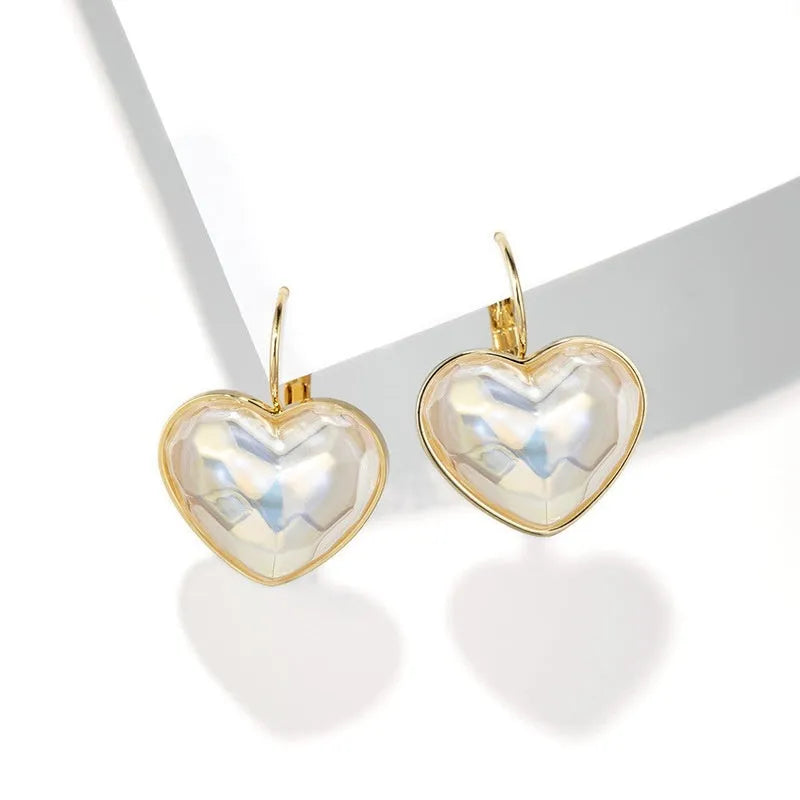 A pair of gold-coloured alloy clip-on earrings for women in a natural style.