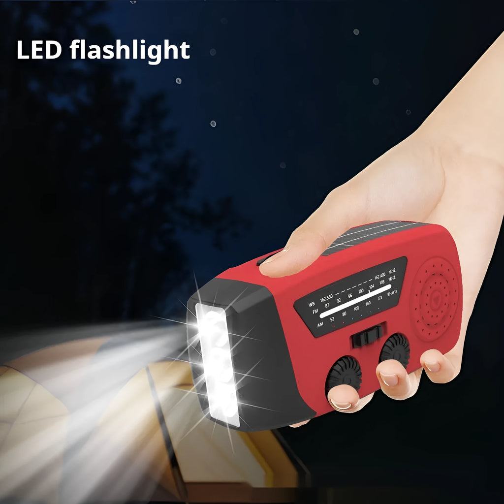 Red rechargeable emergency hand radio with torch, built-in speaker, wrist strap, and Type-C charging cable.