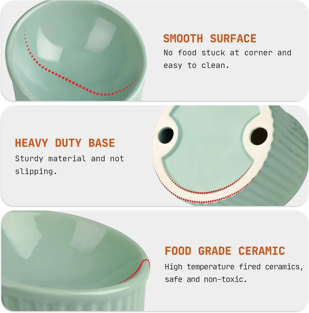 A dark green elevated ceramic cat bowl with a tilted, round design on a wooden surface.