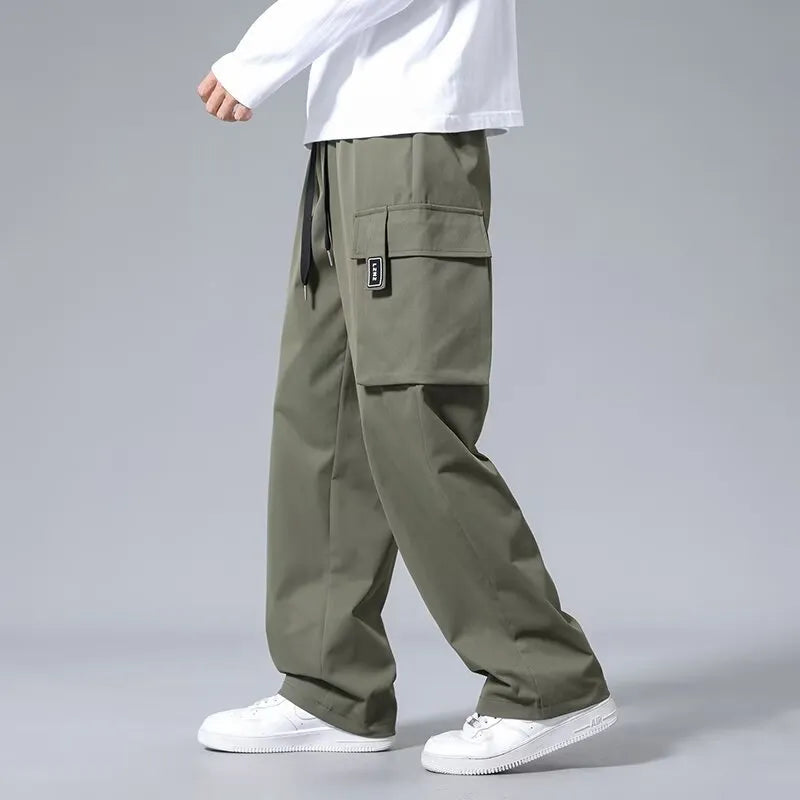 Boys straight leg cargo trousers with drawstring waist and large pockets in polyester fabric