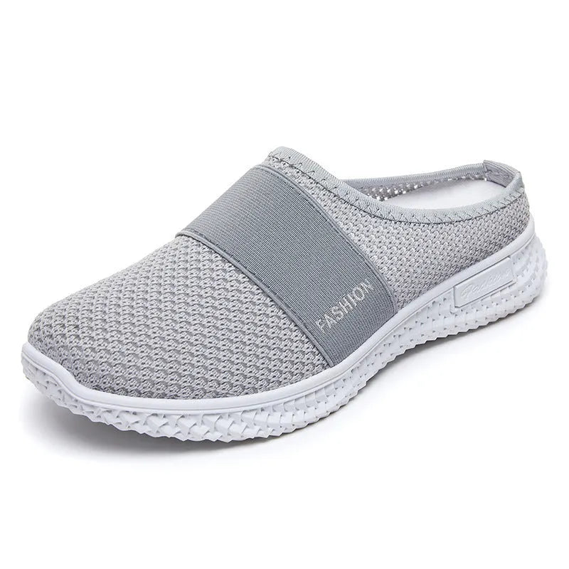 Women's casual flat shoes with mesh upper and hollow-out design in black, grey, pink or purple.