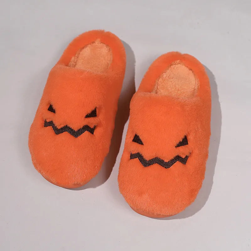 Orange Halloween pumpkin design slippers with plush lining and a textured PVC sole.