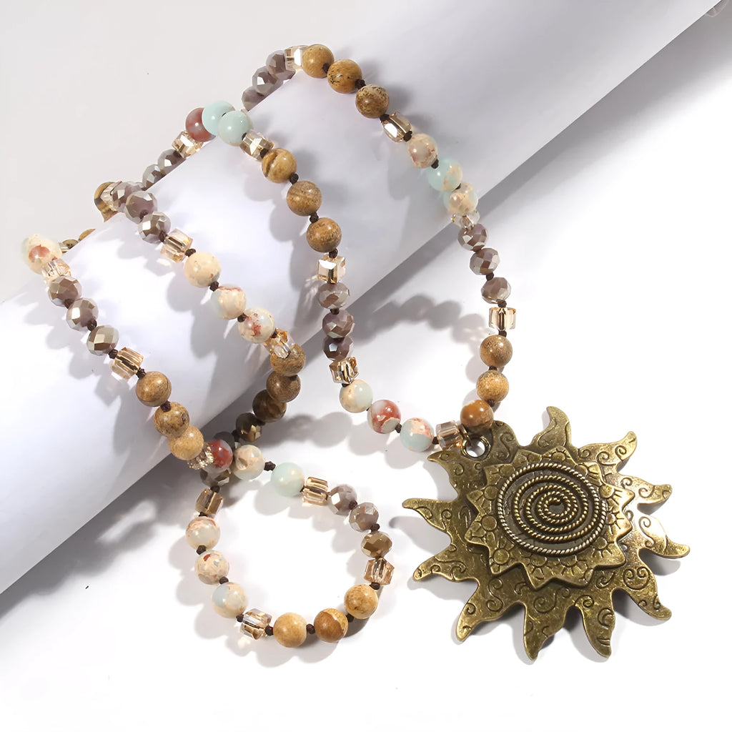 Natural stone beaded necklace with ancient cyan sun pendant and glass knotted chain in black or dark brown.