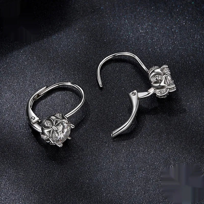 Sterling silver flower bud clip earrings with moissanite centre stone and white gold plating