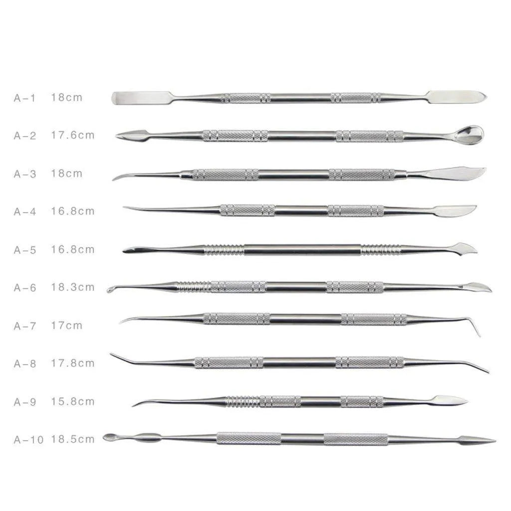 Ten stainless steel clay knives with photo colour handles arranged on a surface for pottery sculpting work.