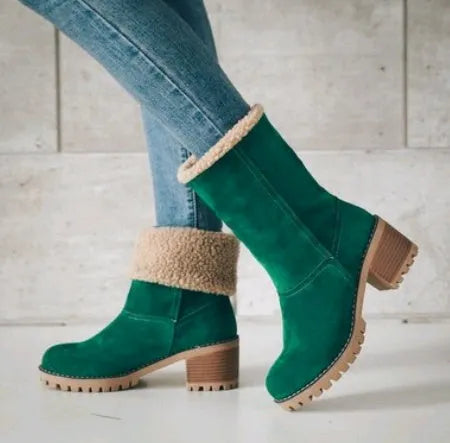 Women's black suede mid-tube snow boots with a thick heel and round toe on a waterproof platform sole.
