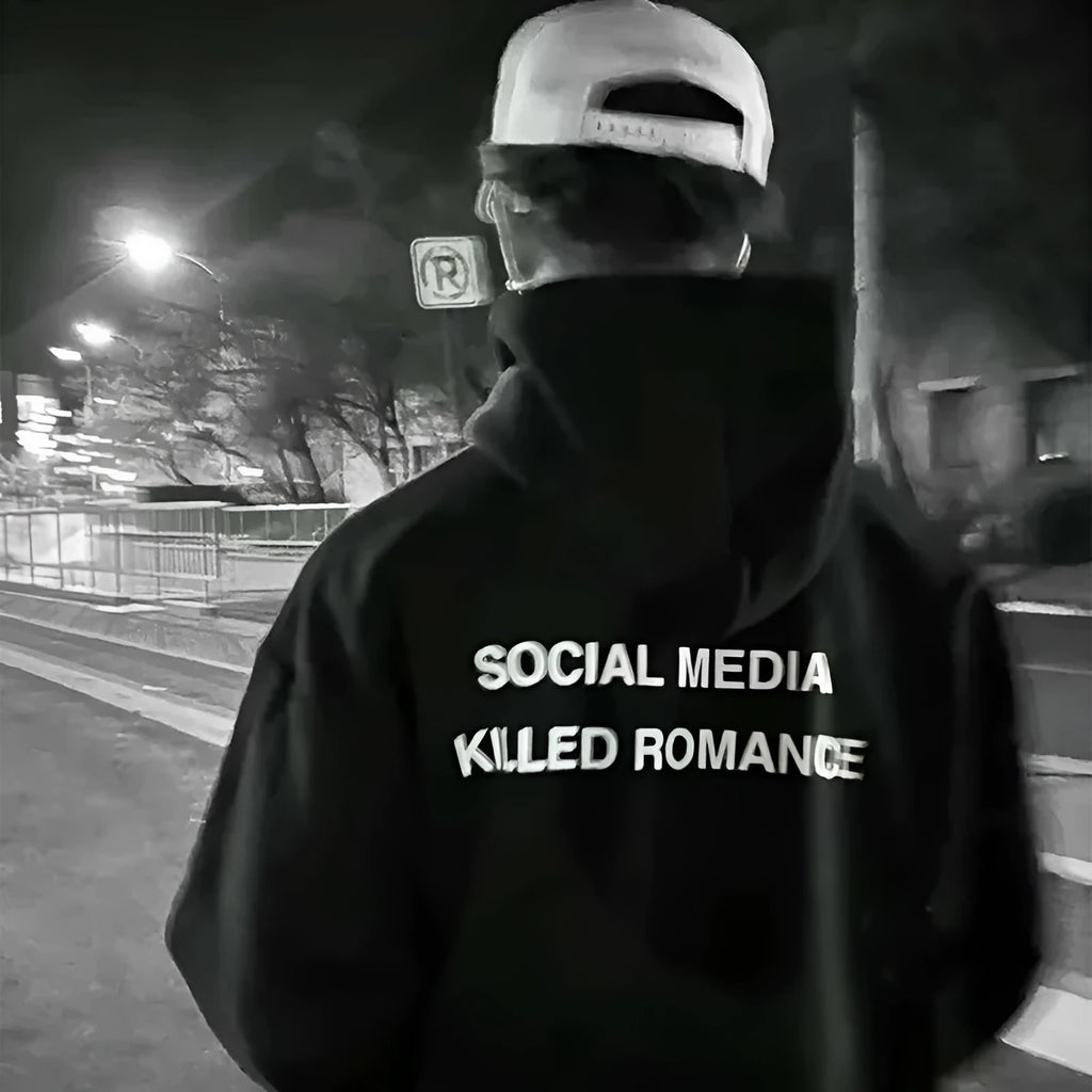 Man wearing a slim fit, long sleeve hoodie with a printed spring letter pattern on the front.