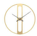 Large round metal wall clock with black dial and gold Arabic numerals on a white wall