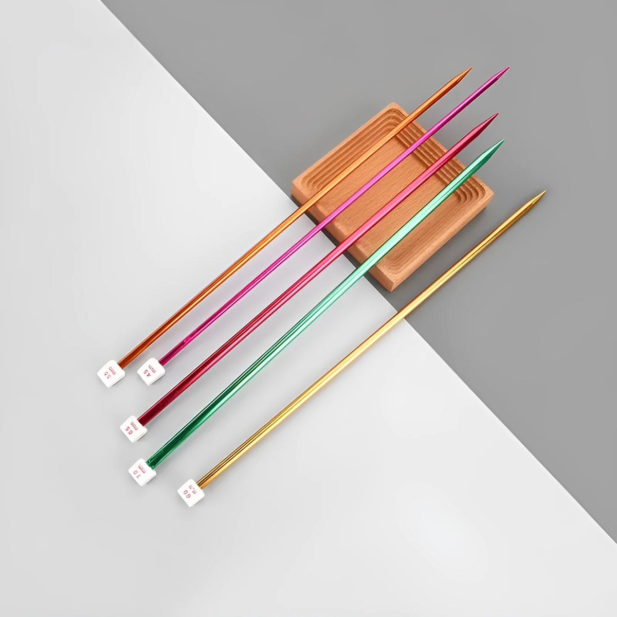 Crochet hook set showing 14 different sizes from 2.0mm to 10.0mm with protective caps and duplicate hooks