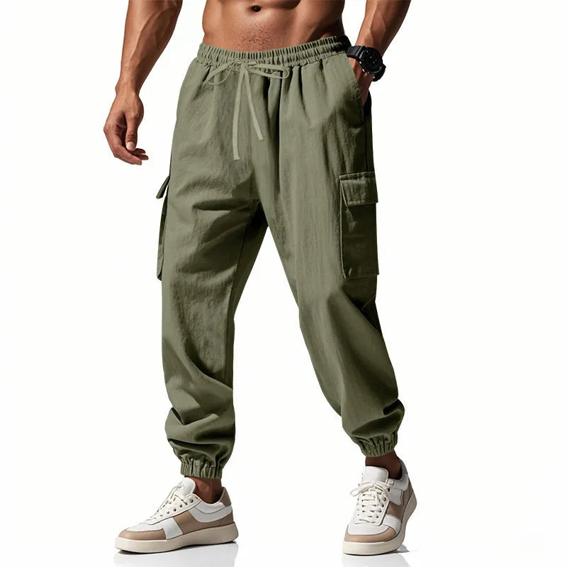 Men's solid colour linen casual trousers with ankle ties and a drawstring waist.