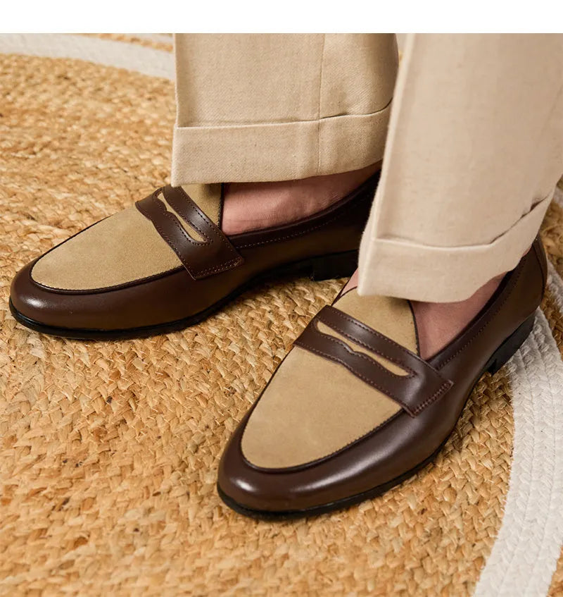 Coffee grey suede leather loafers with an elastic kick tab closure and a rubber sole.