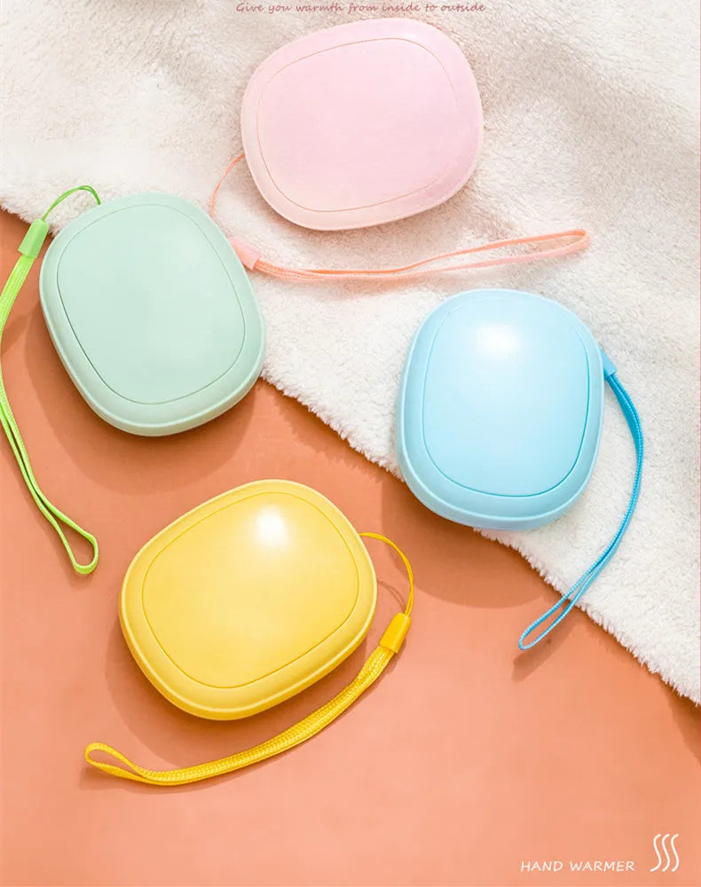 Compact USB hand warmer in pebble shape with single side heating, available in pink blue green beige colours