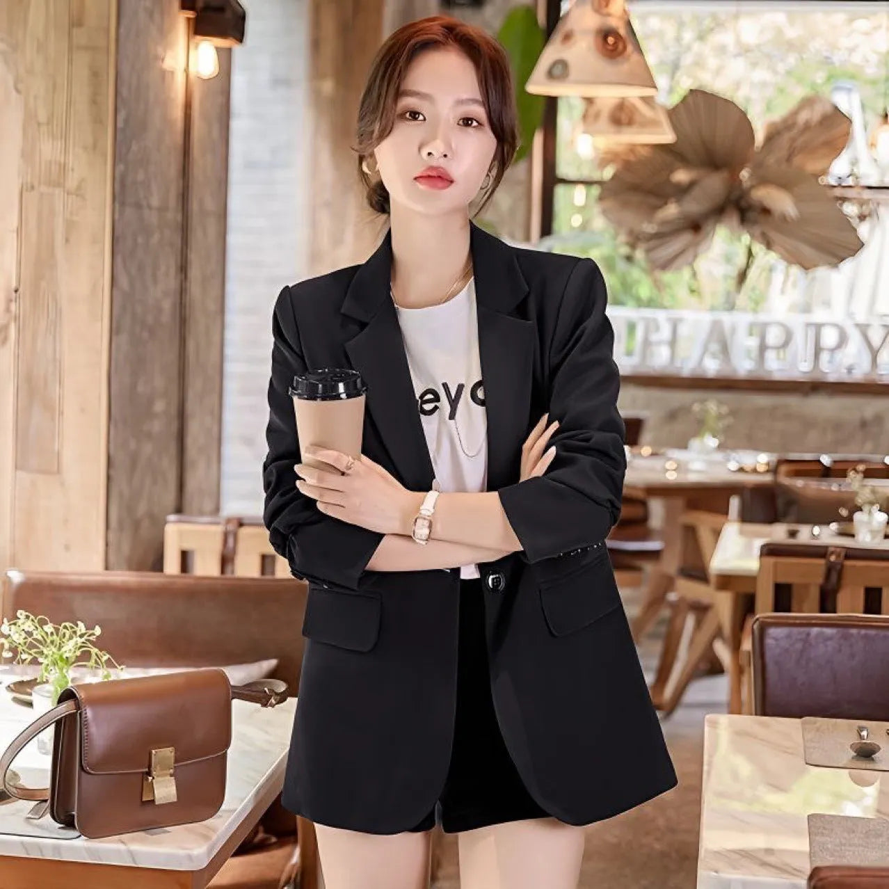 Women's split casual mid-length tailored suit top with three-dimensional pattern, long sleeves, in green colour on model