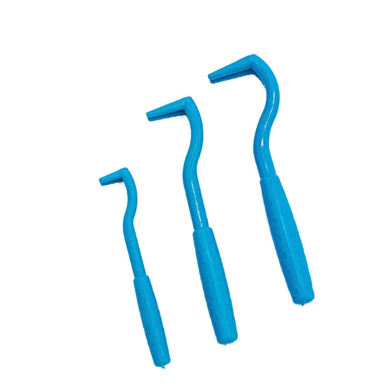 Three blue and green plastic pet tick removal tools with hook design on a white background