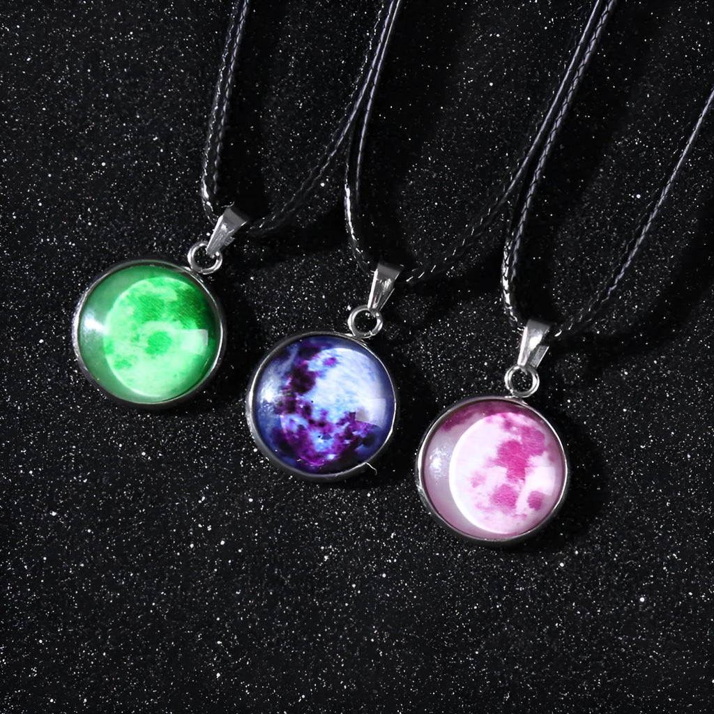 Luminous constellation glass pendant necklace with a moon and night sky design on an adjustable chain