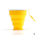 Portable collapsible water cup in blue with stainless steel rim and attached lanyard