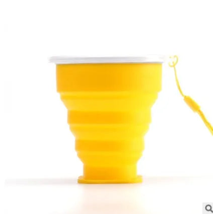 Portable collapsible water cup in blue with stainless steel rim and attached lanyard