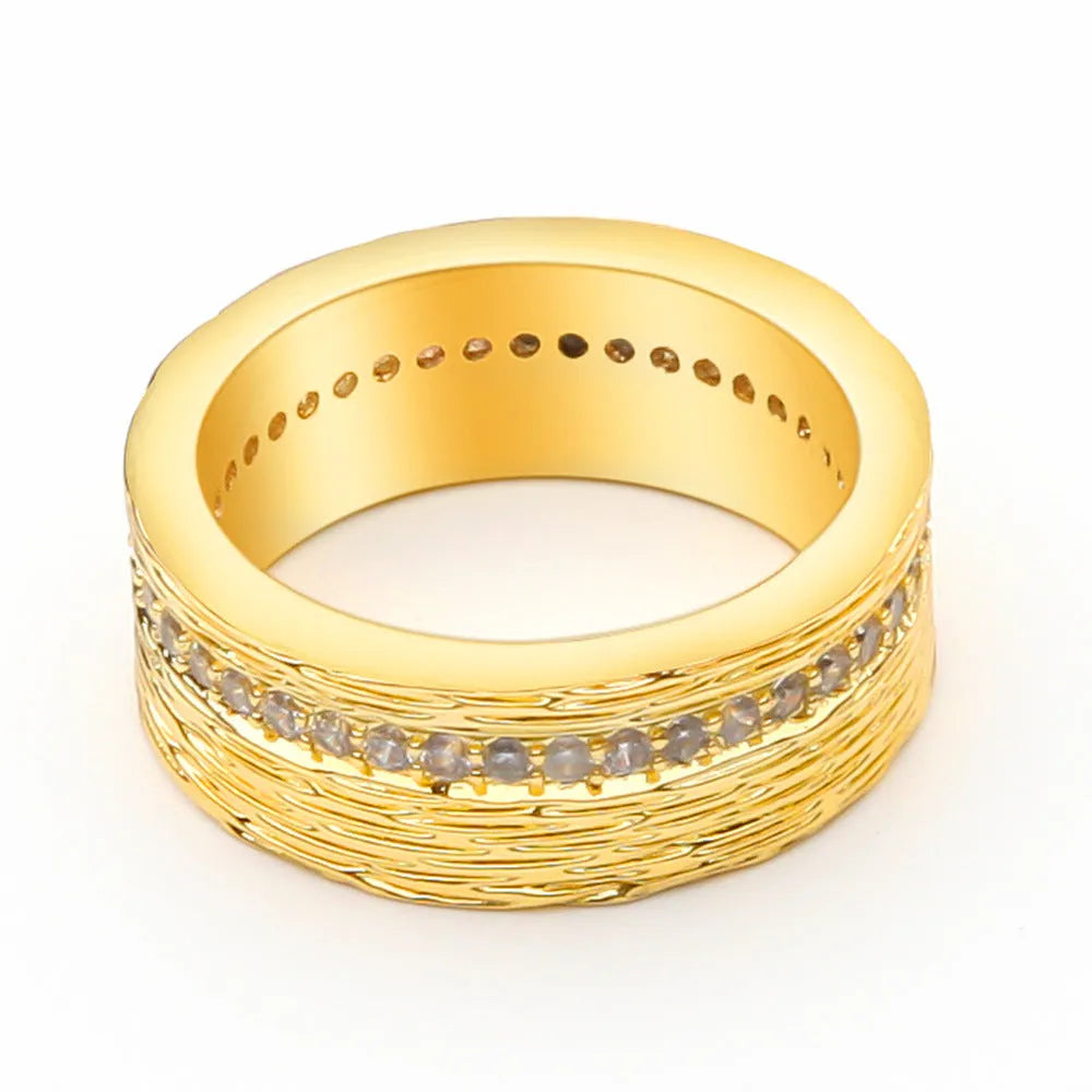 Gold geometric zircon ring on finger showing angular design and electroplated finish