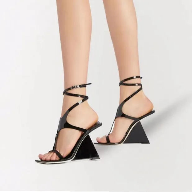 Women's black high heel sandals with a square toe and 9.5cm heel, showing button closure.