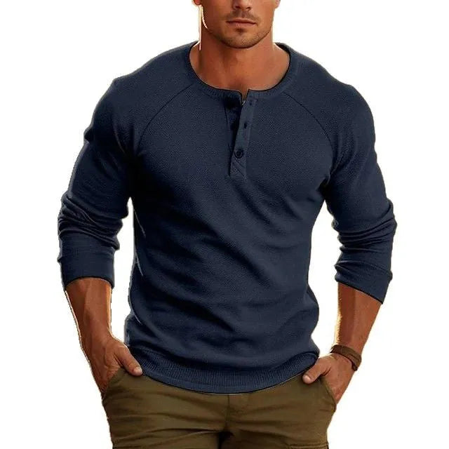 Men's white long-sleeved t-shirt with a Henry collar on a hanger.