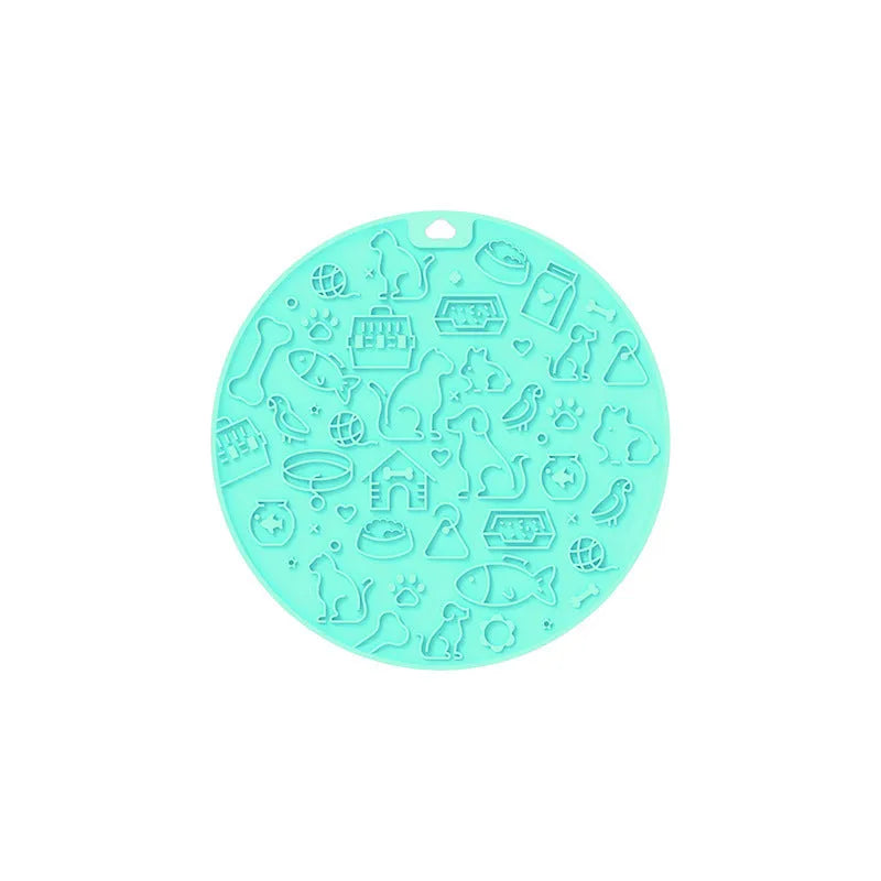Round blue silicone pet licking mat with textured surface and white suction cup base