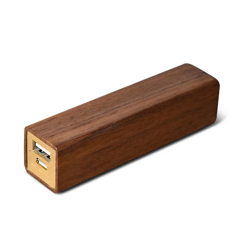 Solid walnut wood portable power bank with 2000mAh battery showing dimensions of 100mm x 25mm x 25mm