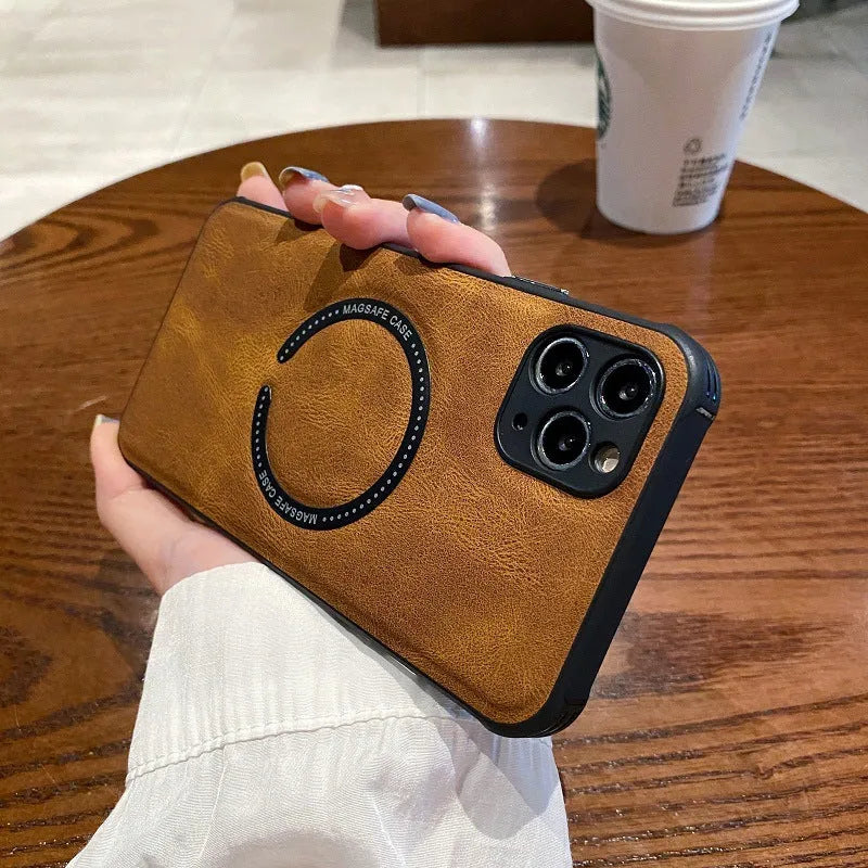 Black imitation leather magnetic charging case for Apple iPhone on a magnetic charging stand.