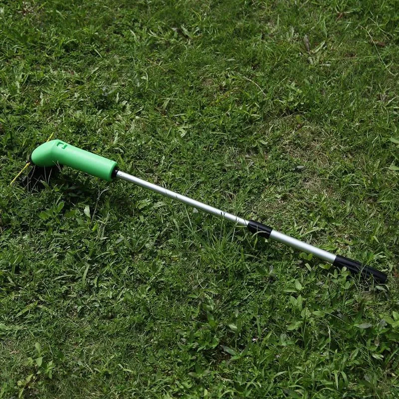 Cordless zip tie lawn trimmer with extension pole and protective debris shield on grass.