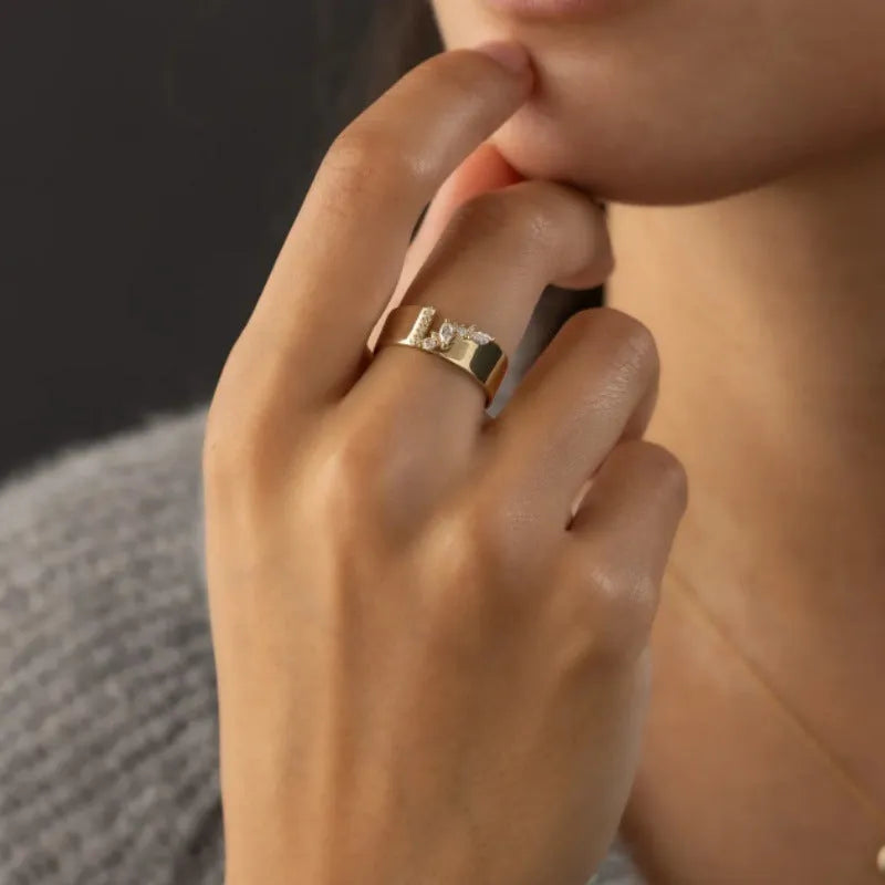 Gold electroplated copper women's fashion ring with shining zircon stones.