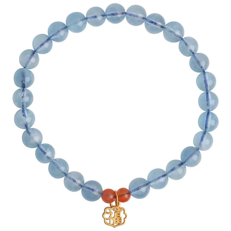 Ice translucent aquamarine bracelet with 8mm round beads and silver sequin accents