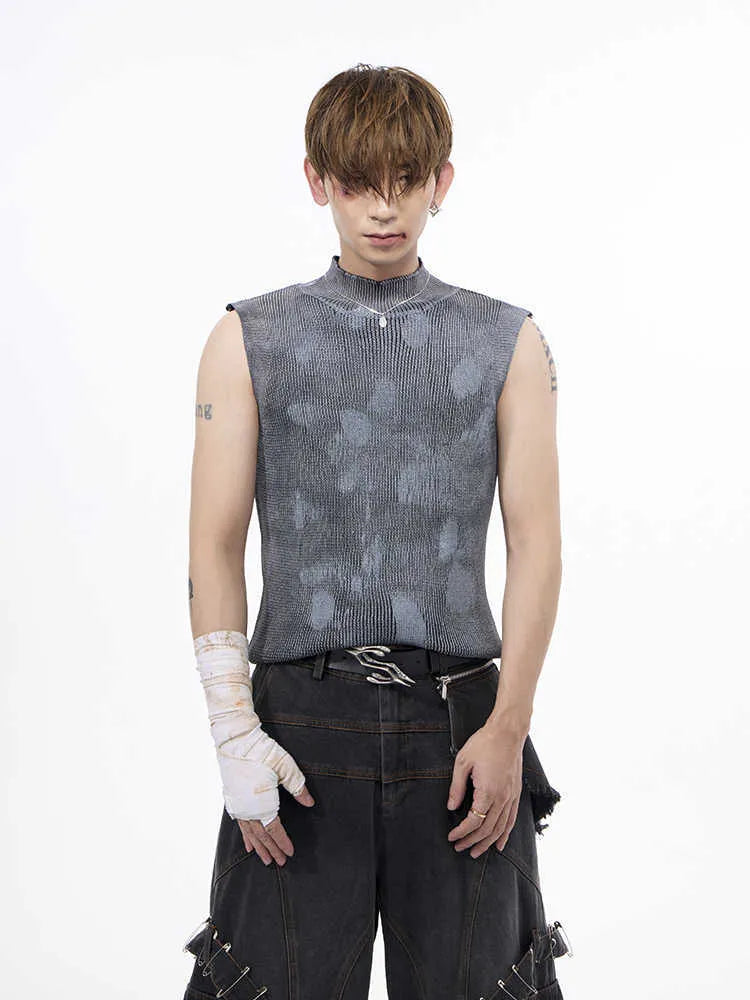 Men's black silver pastebrushing wool sleeveless top with turtleneck collar on mannequin