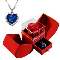 Red eternal rose necklace in apple-shaped jewellery gift box on display