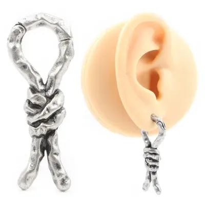 Close-up of a single 4mm copper Creative Bends and Hitches earring with a bent wire design for cartilage piercings.