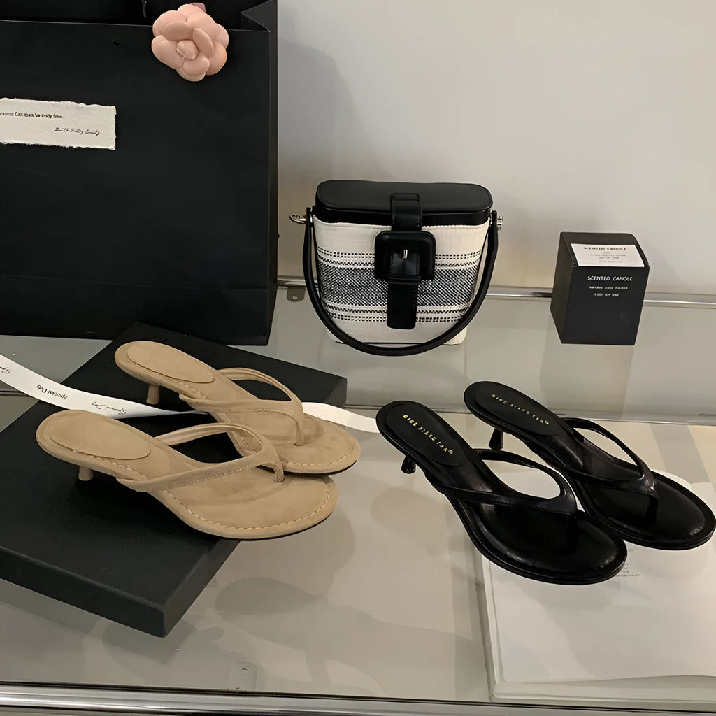 Women's simple round toe stiletto sandals in rubber, shown in classic black and sheepskin camel colours.