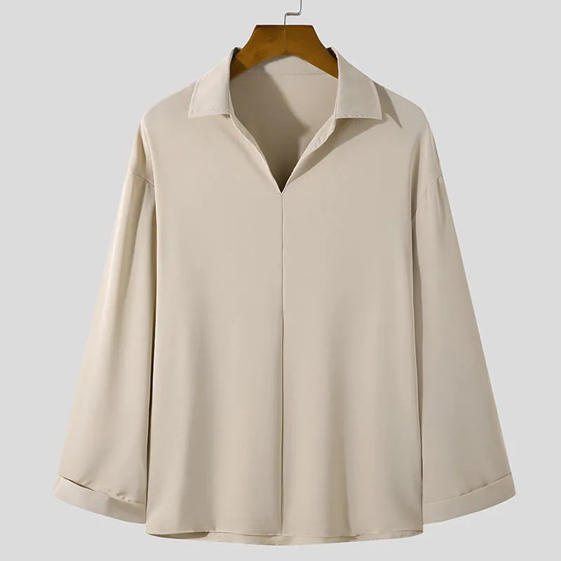Men's loose lapel casual long sleeve shirt in a solid colour on a hanger