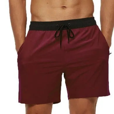 Men's blue athletic shorts with stitching waistband, drawstring and headband for running