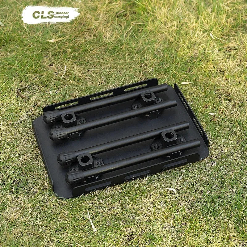 CLS aluminium folding camping stool shown in army green, converted into a small raised table next to a storage bag.