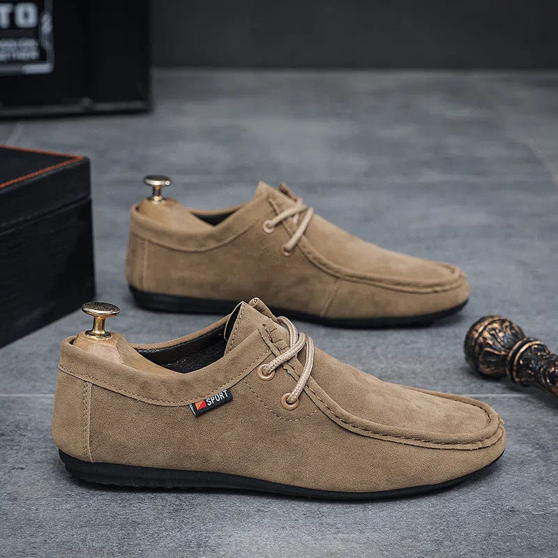 Men's casual slip-on loafers in brown with round toe, stitching, and non-slip plastic outsole