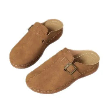 Women's casual wedge slipper in light brown with cloth upper and rubber sole.
