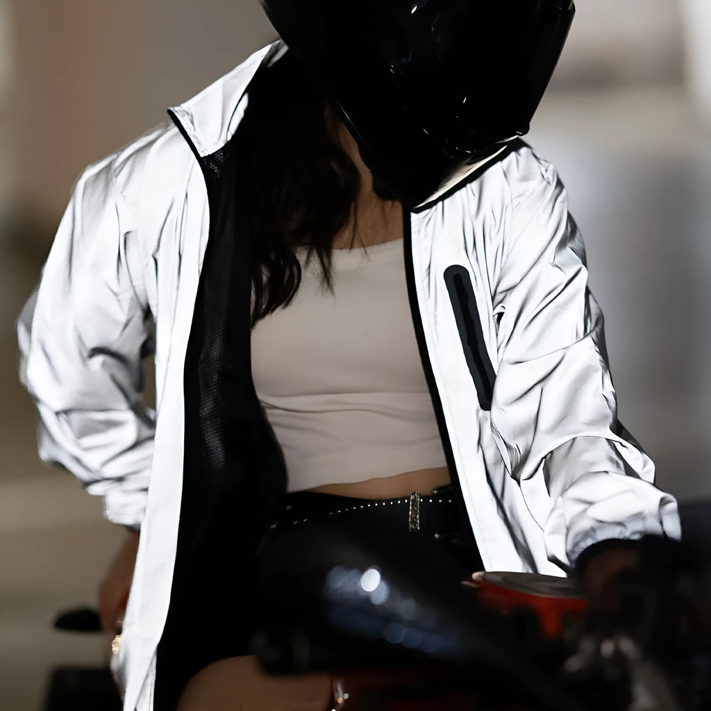 Silver waterproof polyester long-sleeved top displayed on a hanger, showing full sleeves and front closure.
