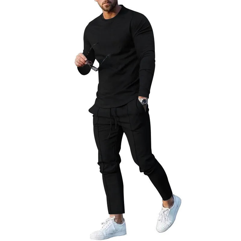 Men's light grey two-piece casual suit with long sleeve T-shirt and trousers on a hanger.