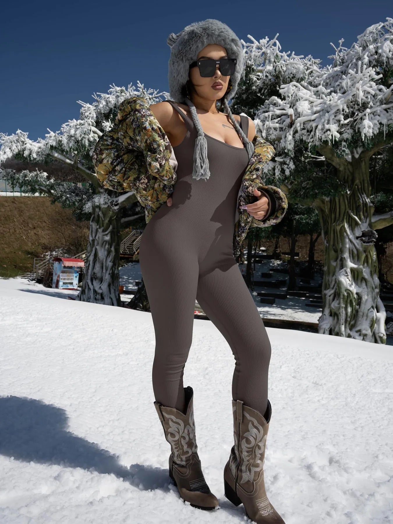 Women's black suspender tank top tights with button fastenings at shoulders showing full-length spandex construction