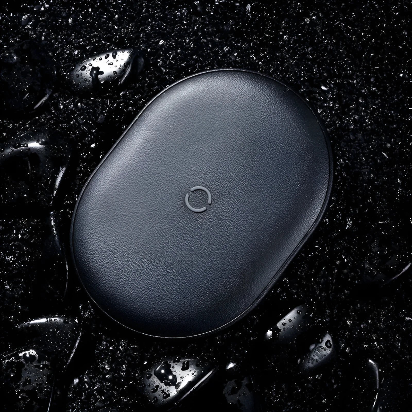 Baseus Rough 15W fast wireless charging pad for mobile phones in black colour on a desk.