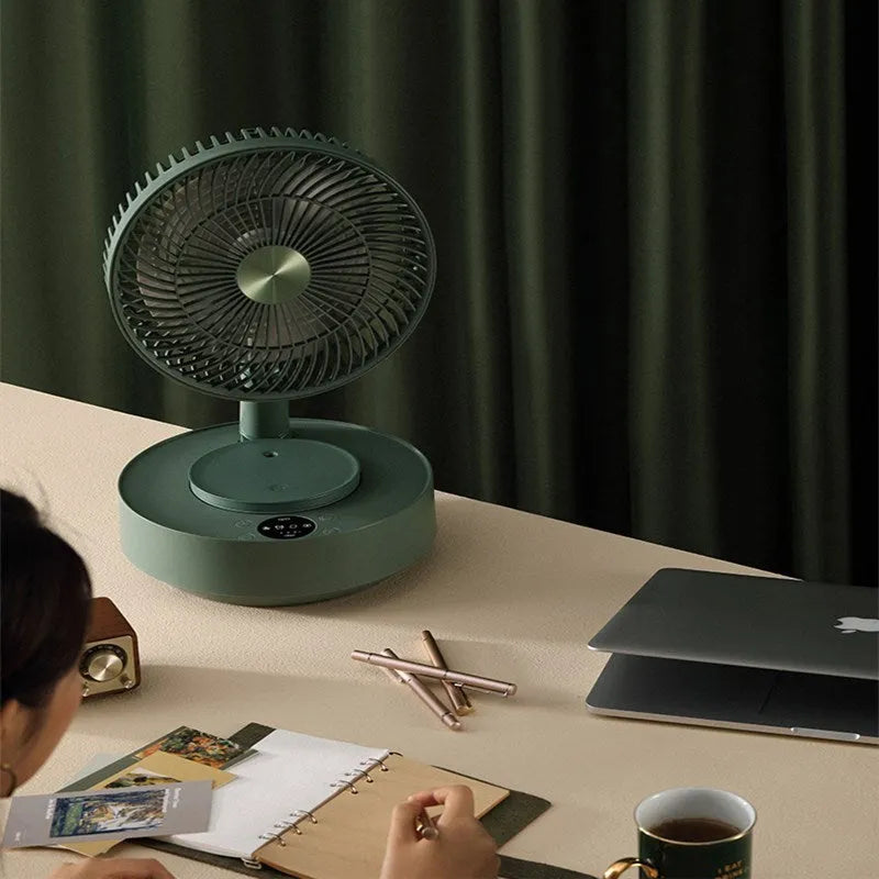 Green and white telescopic rechargeable floor fan with remote control, shown in both desktop and extended height modes.