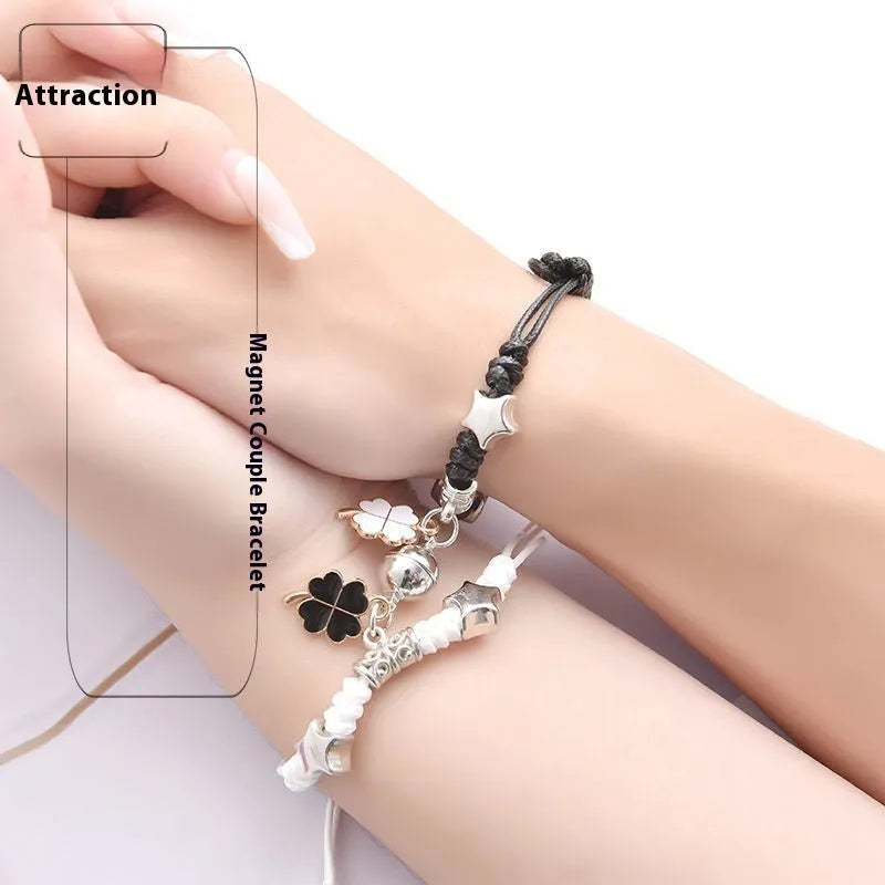 Pair of silver alloy magnet clasp couple bracelets showing example designs like clover, crown, and love symbols.