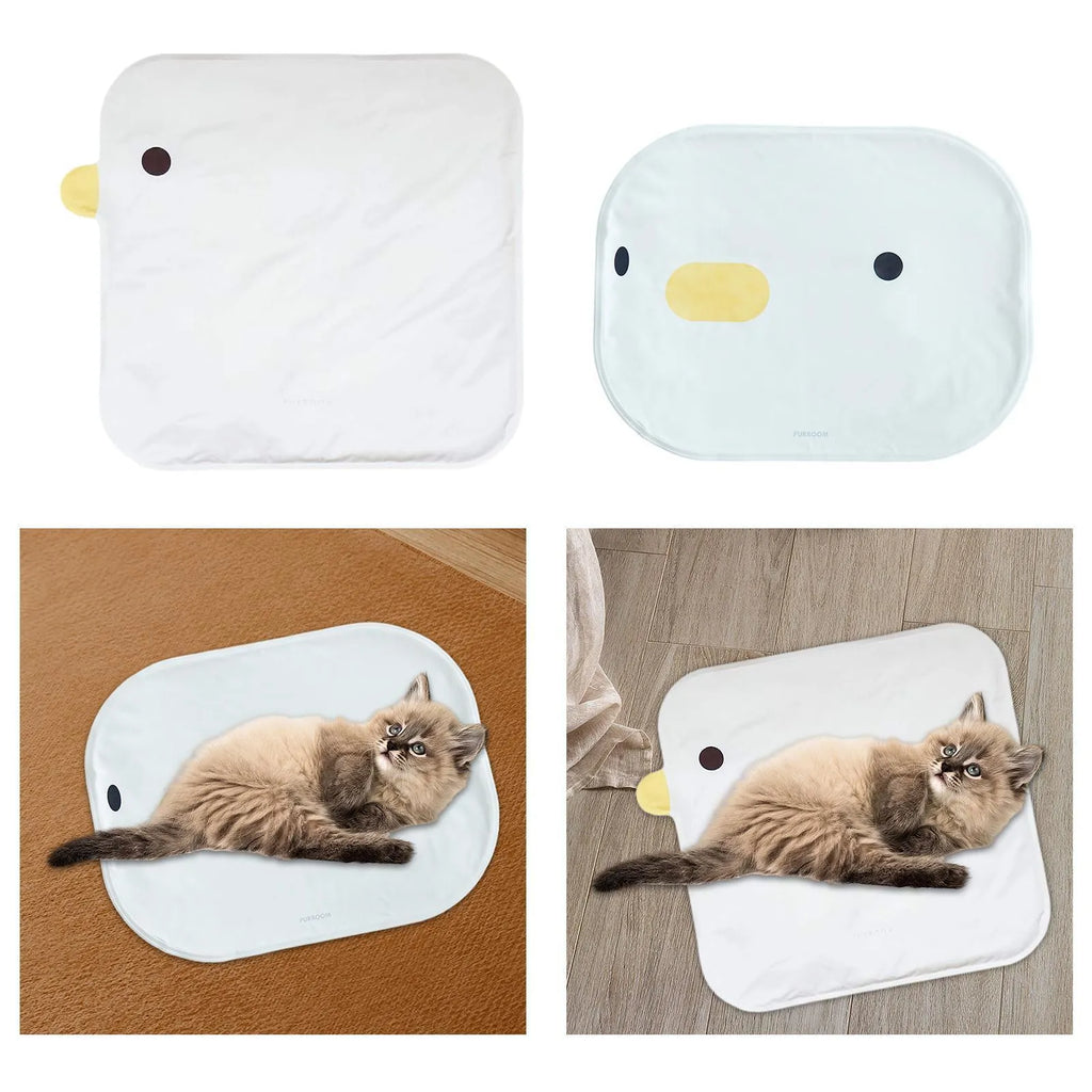 Yellow chick-shaped pet cooling mat on a wooden floor, showing non-stick fabric surface.