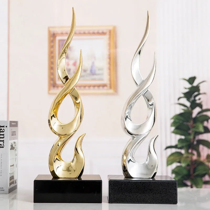 Resin decorative ornament in gold colour with modern minimalist design for festival decoration