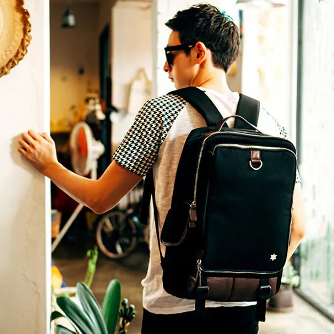 Large men's backpack in Oxford cloth, shown in grey, with dimensions 30cm by 16cm by 46cm.