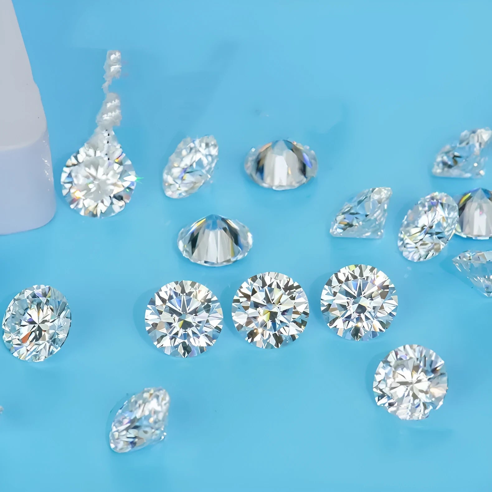 Round brilliant cut Moissanite loose gemstone showing eight hearts and eight arrows pattern.